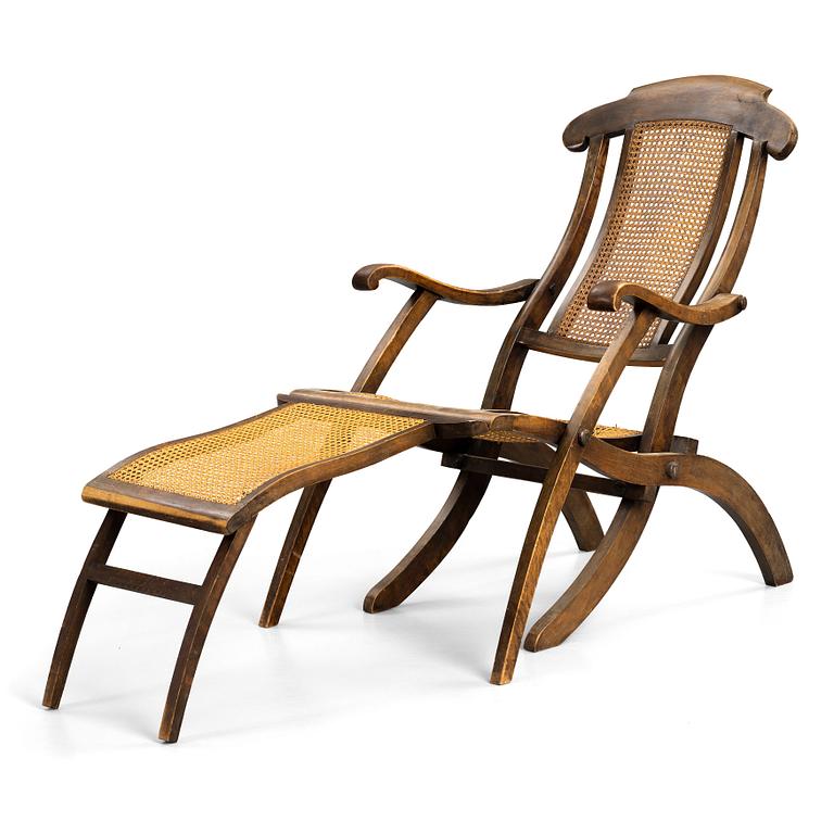 A stained wood and rattan deck chair, first half of 20th century.