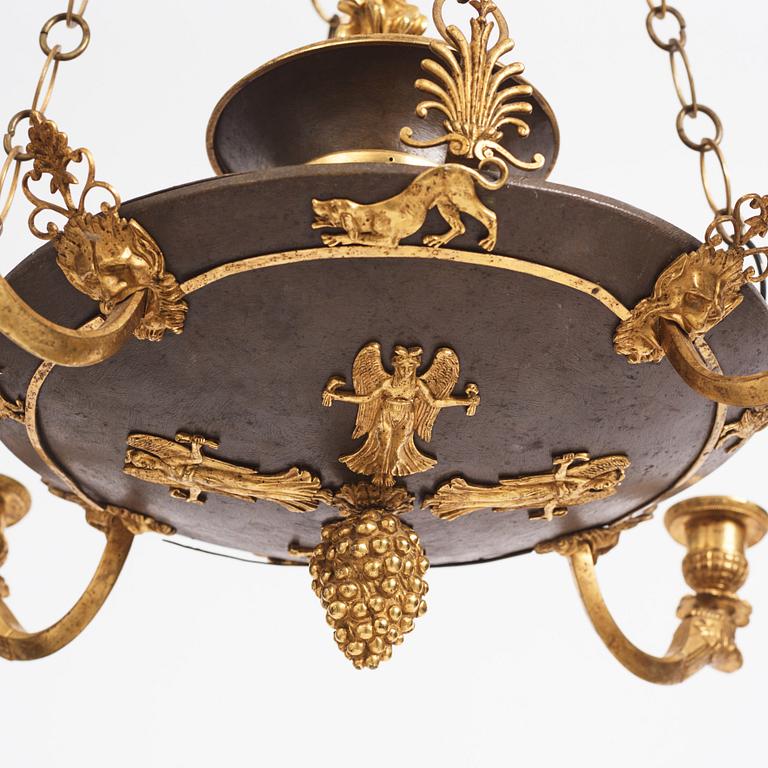 An ormolu and painted bronze four-light Empire chandelier, early 19th century.