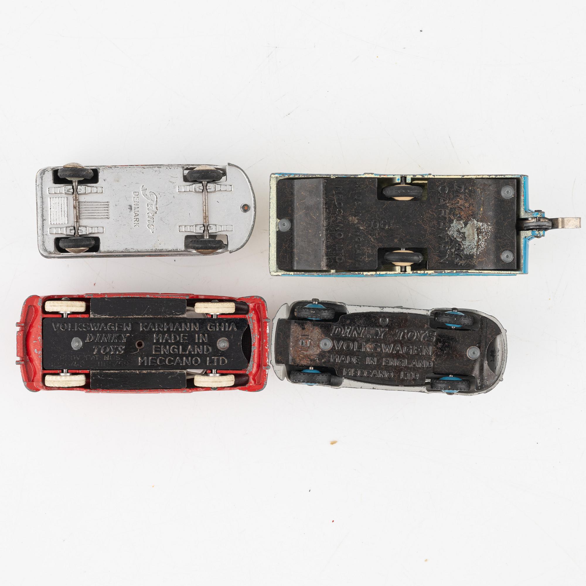 Nine toy cars, mostly Dinky toys.