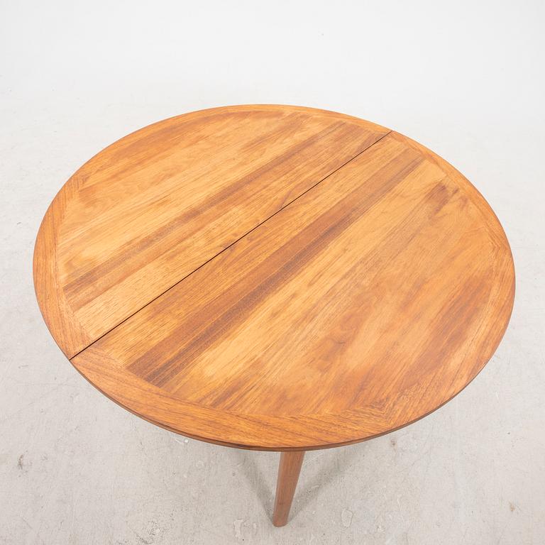 A 1960s walnut Linden dining table.