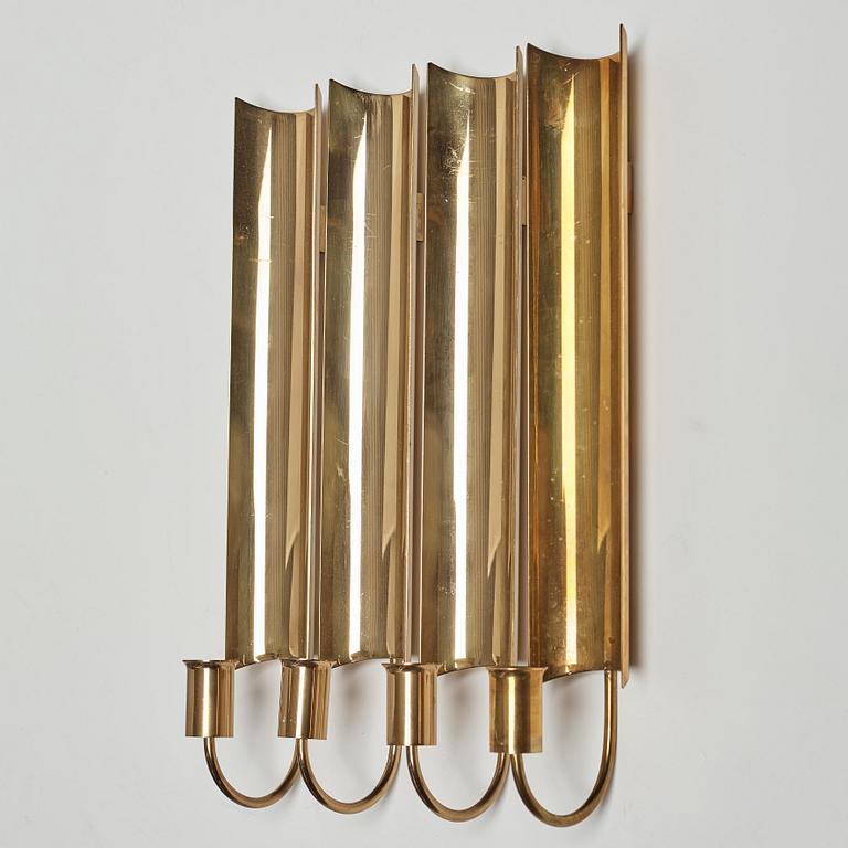 A set of four 'Reflex' brass wall scones by Pierre Forsell, Skultuna.