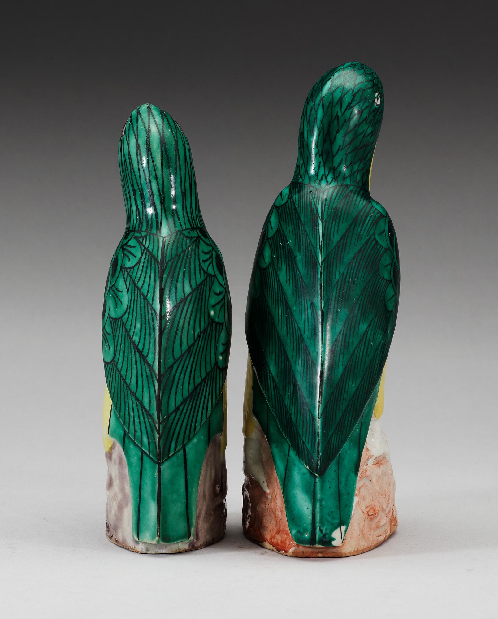 A set of two green and yellow glazed parrots, Qing dynasty, Jiaqing (1796-1820).