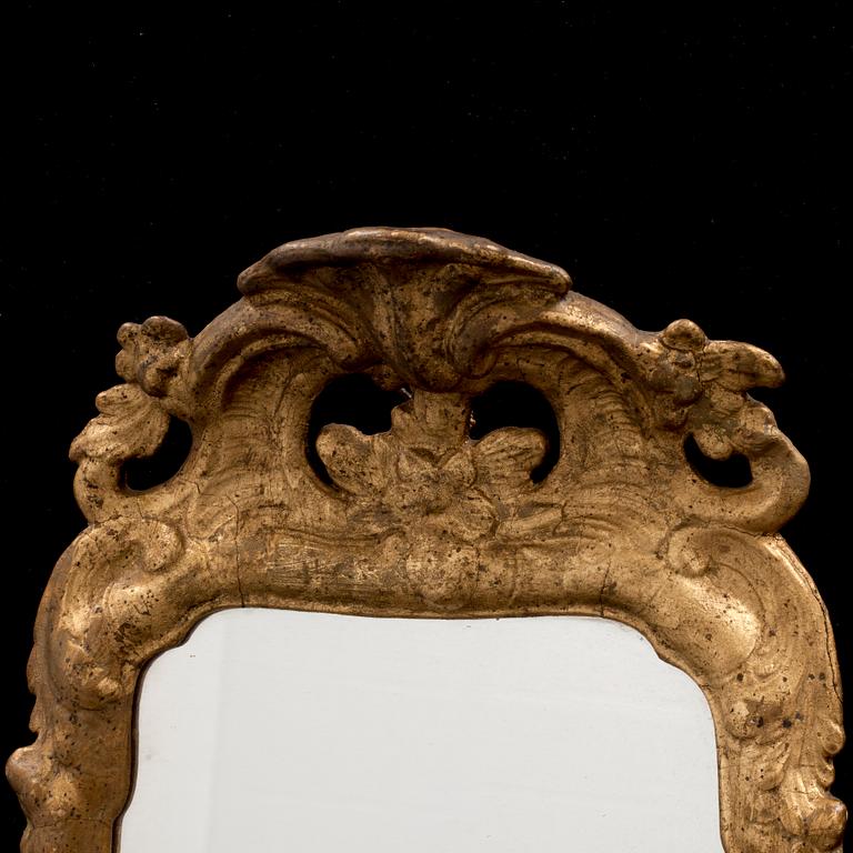 A pair of Swedish Rococo one-light girandole mirrors.