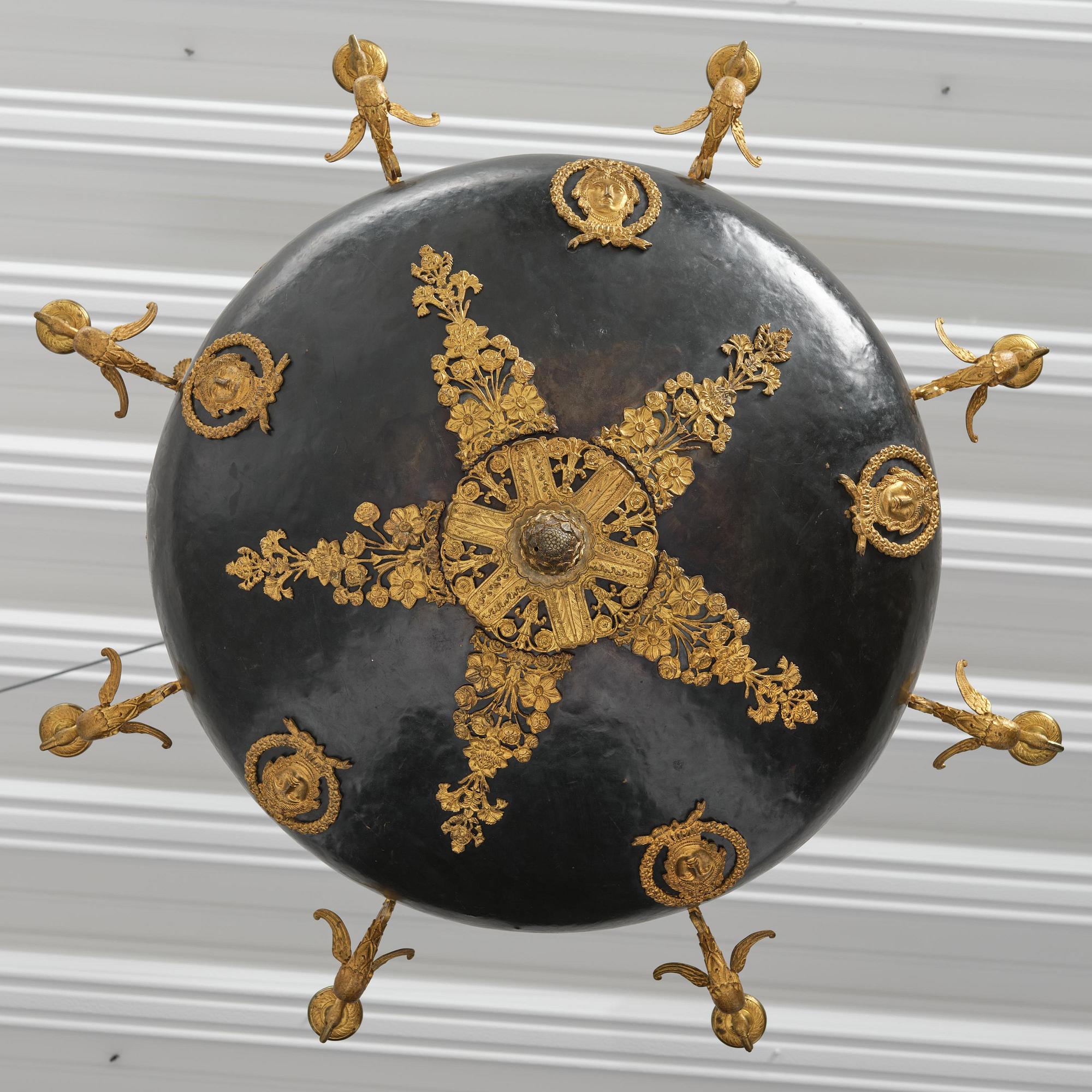 A presumably Russian Empire gilt and patinated bronze nine-branch chandelier, 19th century.