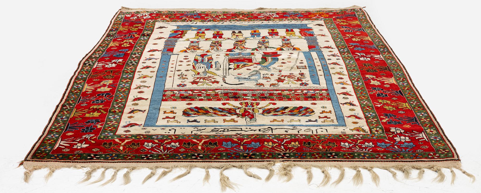 A pictoral Qashqai rug, Southwest Persia, c. 222 x 152 cm.