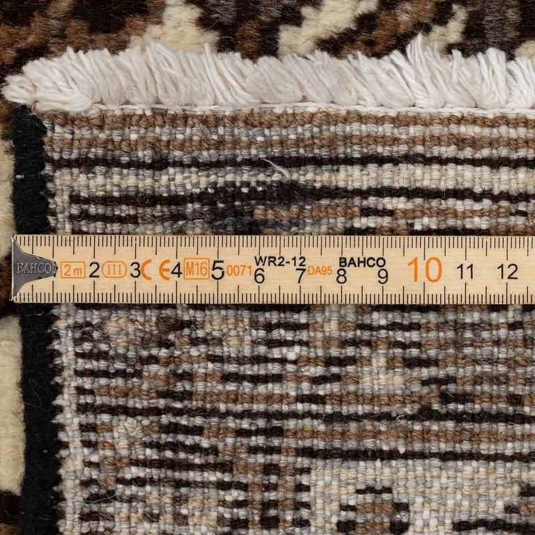 A Ferdos carpet, c. 295 x 210 cm.