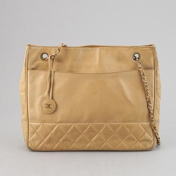Chanel, a beige leather handbag, 1986-1988.