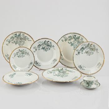 A 124-piece creamware dinner service, "Wexiö guld", Gustavsberg, Sweden, around 1900.