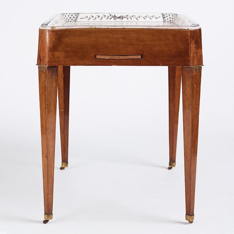 A Gustavian mahogany and faience tea table, late 18th century.