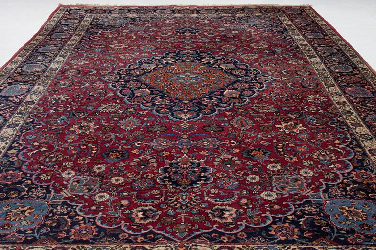 A semi-antique Mashad carpet, Eastern Iran, signed c. 507 x 303 cm.