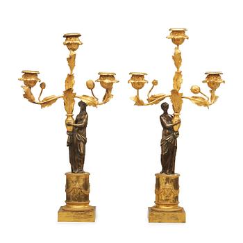 500. A pair of Louis XVI circa 1800 three-light candelabra.