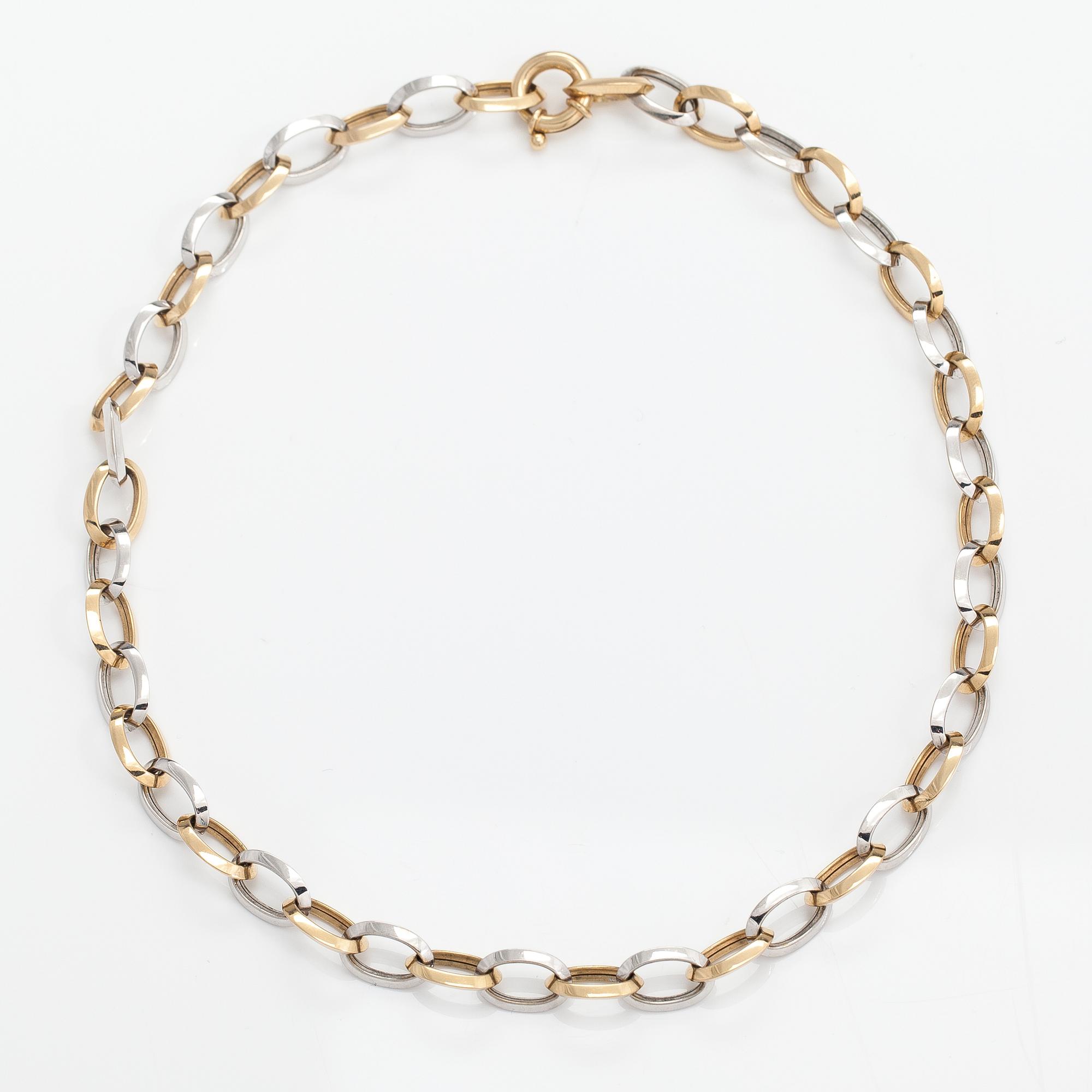 A 14K white and yellow gold necklace.