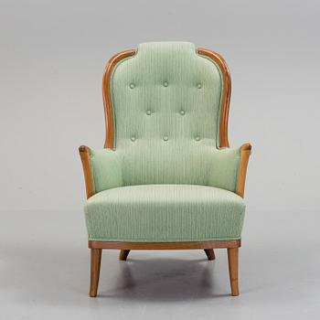 a Carl Malmsten "Vår Fru" armchair from the second half of the 20th century.