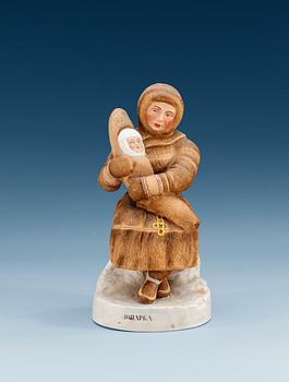 A Russian Gardner figure of a Eijnar laplander woman and child, (Dmitrovsk Porcelain Factory) 1929-34.