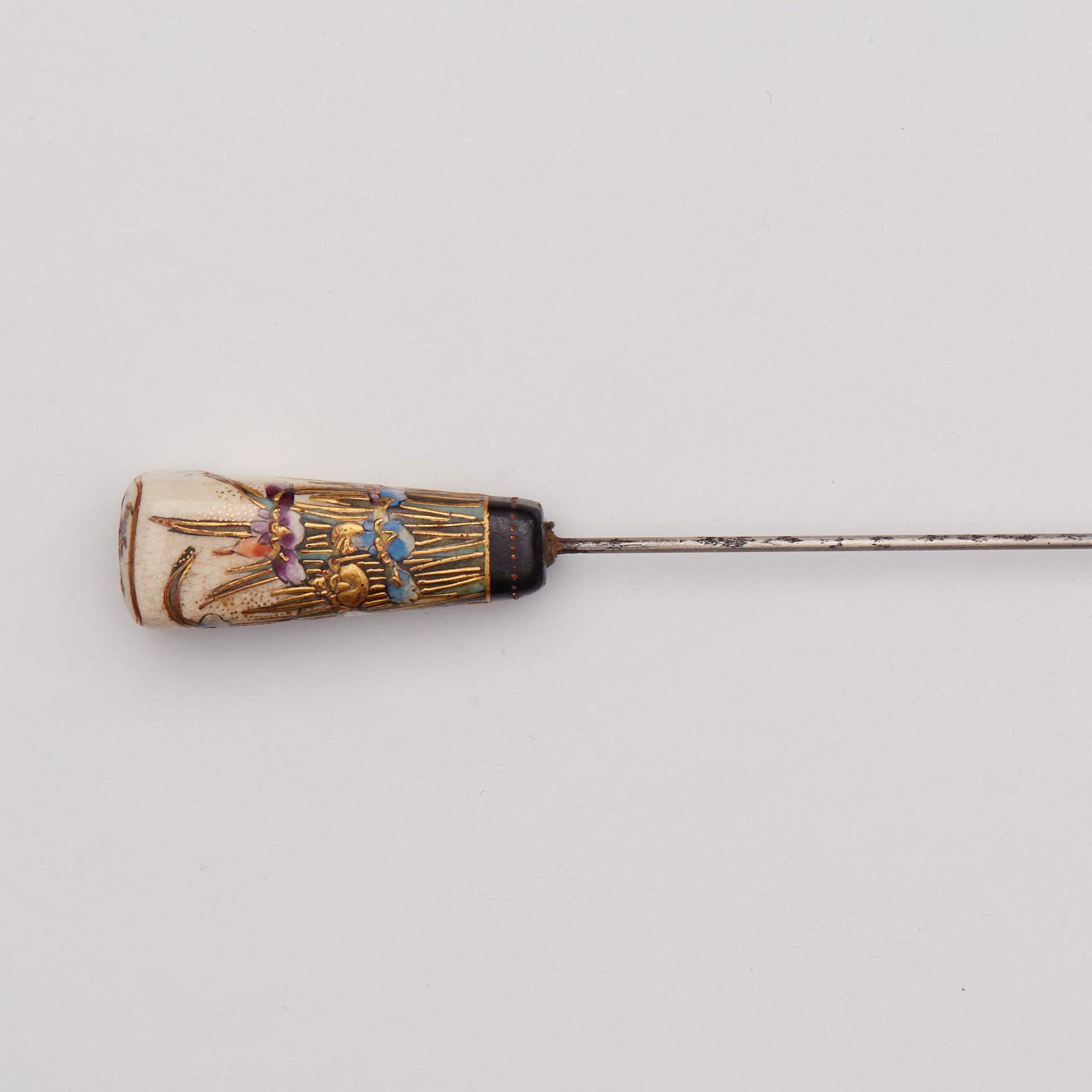 A Japanese painted hat pin, Meiji (1868-1912).