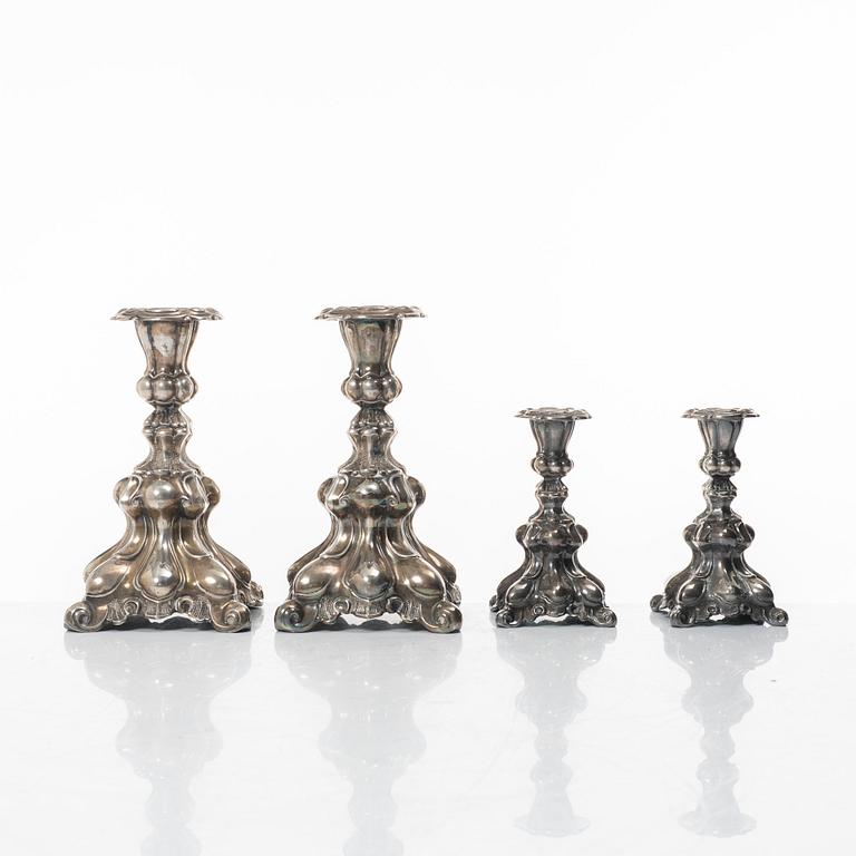 Four Baroque style silver candlesticks, 20th century.
