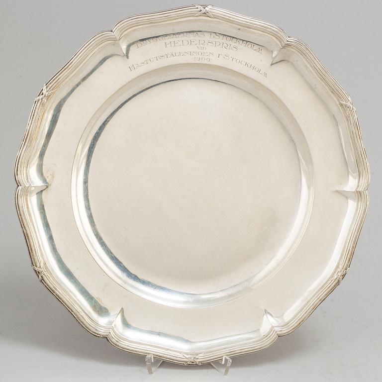 Two silver plates, including K Andersson, Stockholm, 1909 and 1914.