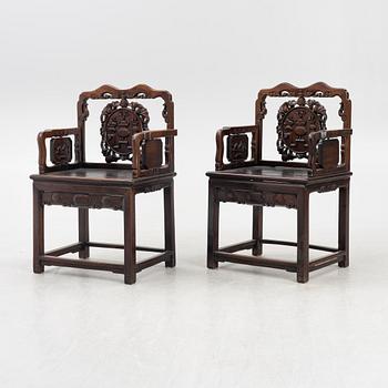 A pair of hardwood armchairs, China, late Qing dynasty/around 1900.