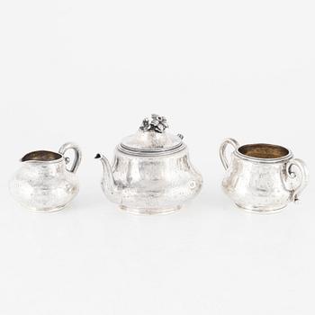 A Silver Teapot, Sugar Bowl and Creamer, France and England, 19th Century.