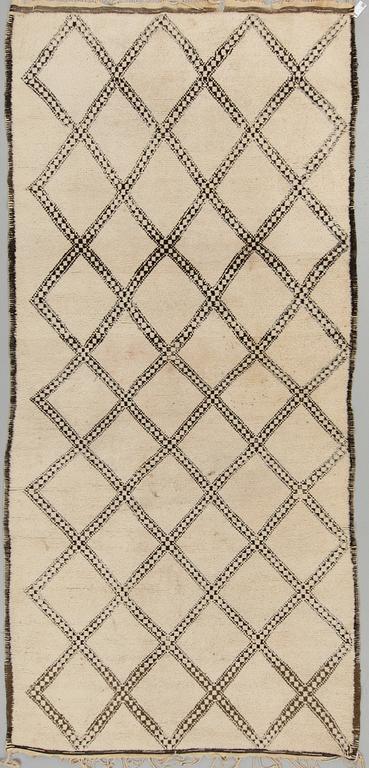 A CARPET, probably Morocco, old, ca 403 x 196 cm (plus a few cm flat weave at each end).