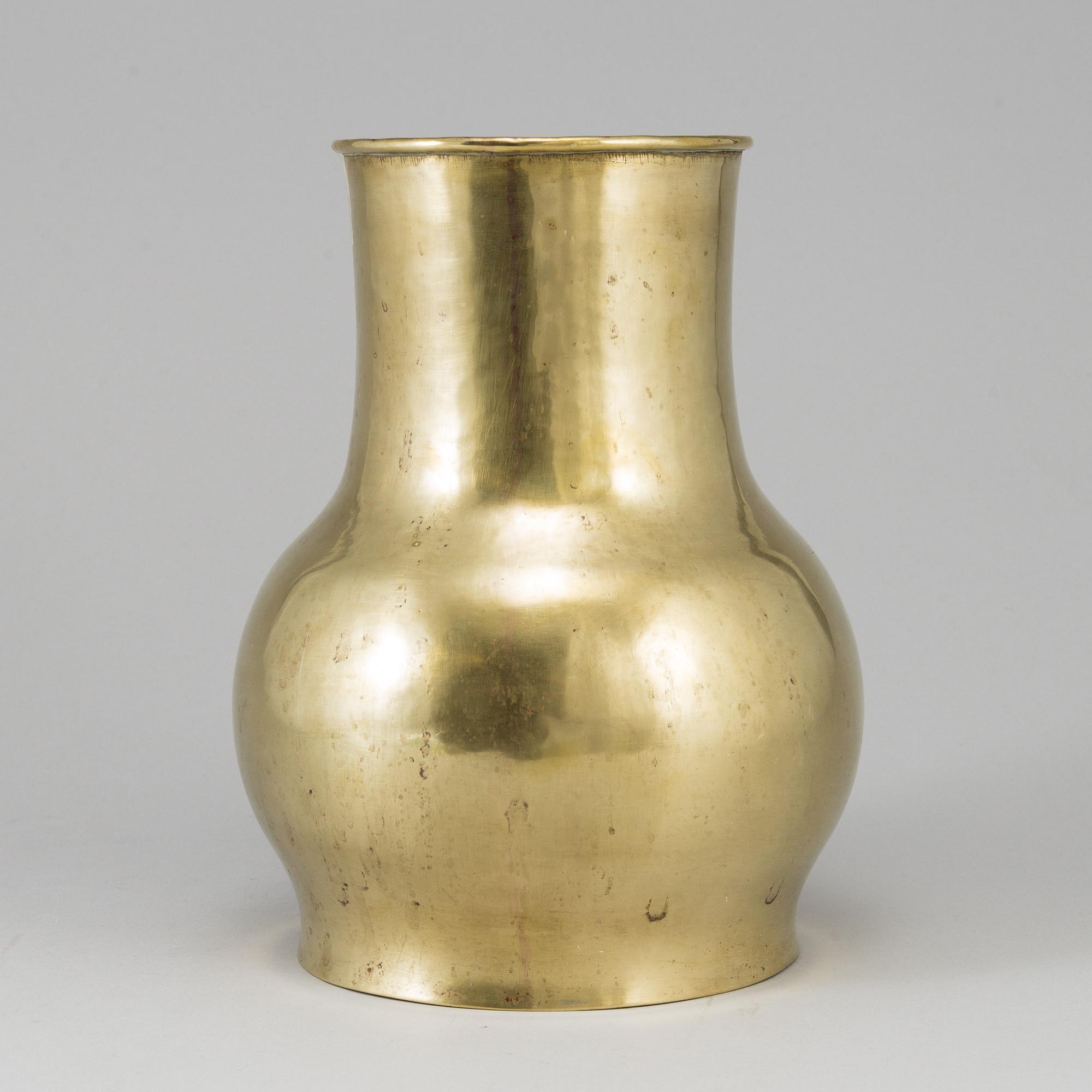 A 19th century brass champagne cooler.