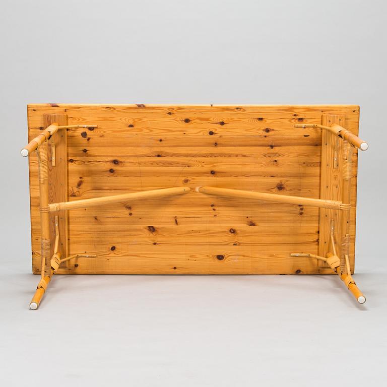 A pine wood and rattan table, late 20th century.