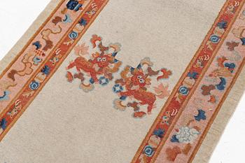 An antique / semi antique runner carpet, China, ca 300 x 96 cm.