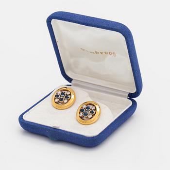 A pair of 18K gold cufflinks with sapphires and ca. 0.40 cts of diamonds. Rahapaja Insignia, Vantaa 2007.