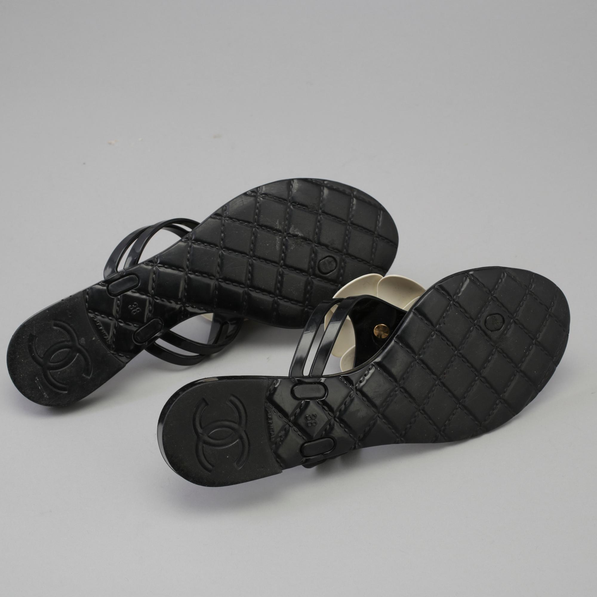 CHANEL, a pair of black plastic sandals. Size 38.