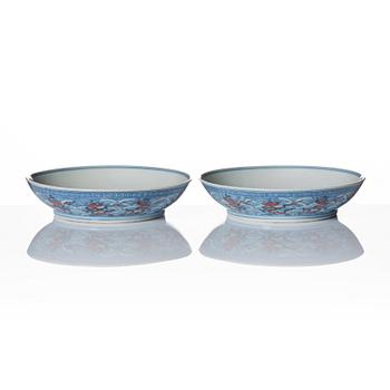 A pair of blue and white and iron red decorated dragon dishes, Qing dynasty with Daoguang mark.