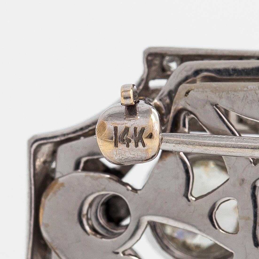 A 14K white gold Art Deco double clip brooch with old-cut diamonds approximately 4.90 cts in total. Austrian importmark.
