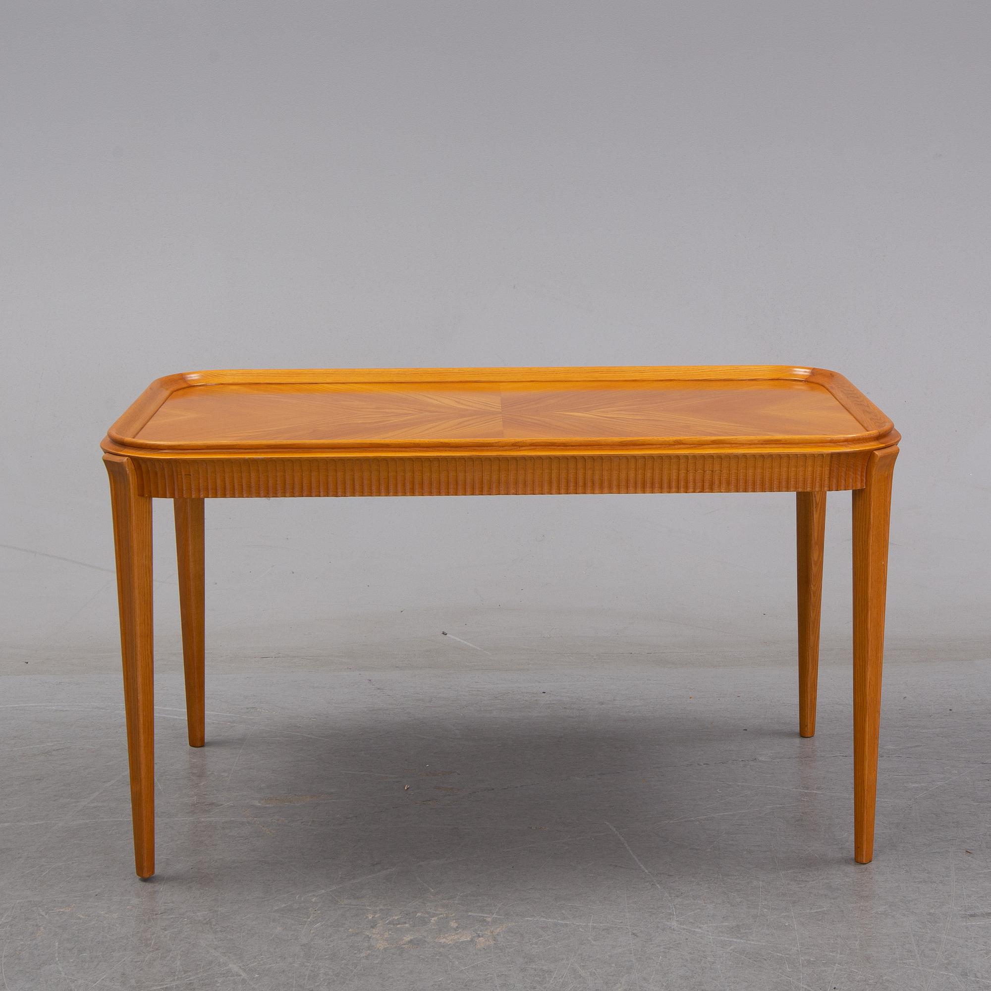 An elm Swedish Modern coffee table, dated 11 11 1947.