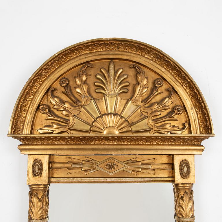 An Empire mirrot, first half of the 19th century.
