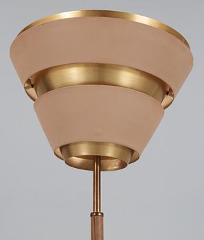 A beige lacquered floor lamp, with brass and artificial leather, possibly a scetch by Alvar Aalto, 1950's.