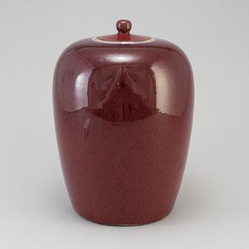 A stoneware lidded urn China 20th century.