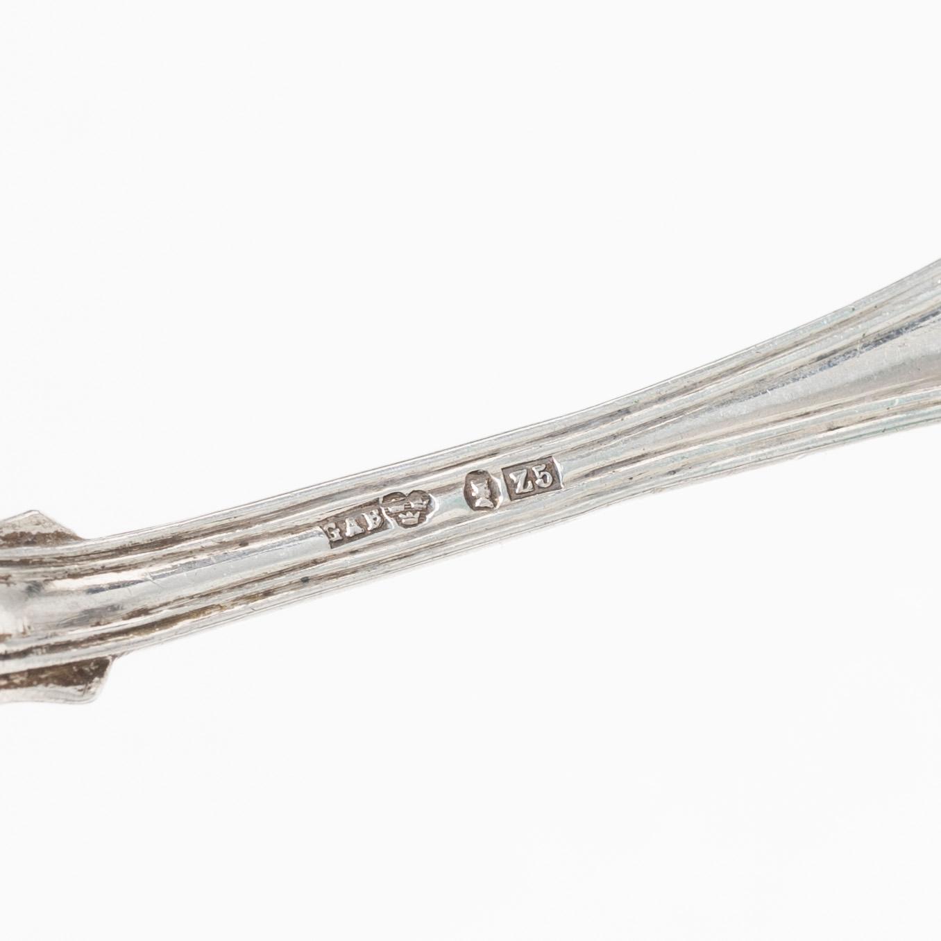 27 pieces of silver flat ware, similar 'Shell' models, including Gustaf Mööenborg, Stockholm, Swedn, 1848-52.