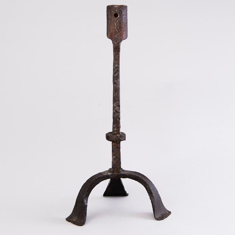 A CANDLESTICK, iron, 18th century or older.