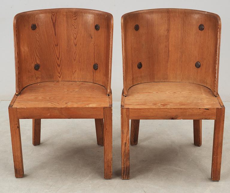 A pair of Axel Einar Hjorth 'Lovö' stained pine armchairs, Nordiska Kompaniet, 1930's.