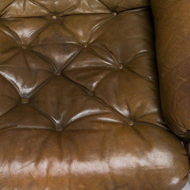 A pair of leather armchairs, 1970s.