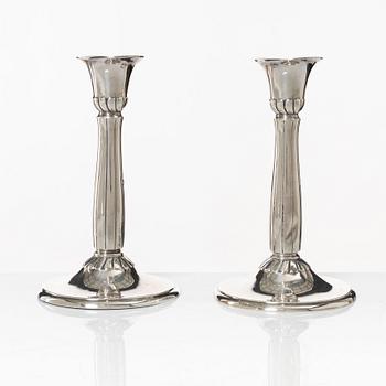 A pair of silver candle sticks, first half of the 20th century.