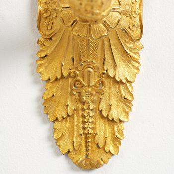 A pair of French Empire five-branch gilt and patinated bronze appliques, first part 19th century.