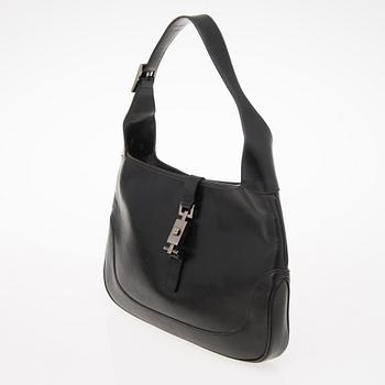 A Black Leather Jackie Bag.