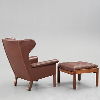 Hans J. Wegner, a pair of "AP-65" easy chairs with stools, AP-stolen, Denmark 1960's.