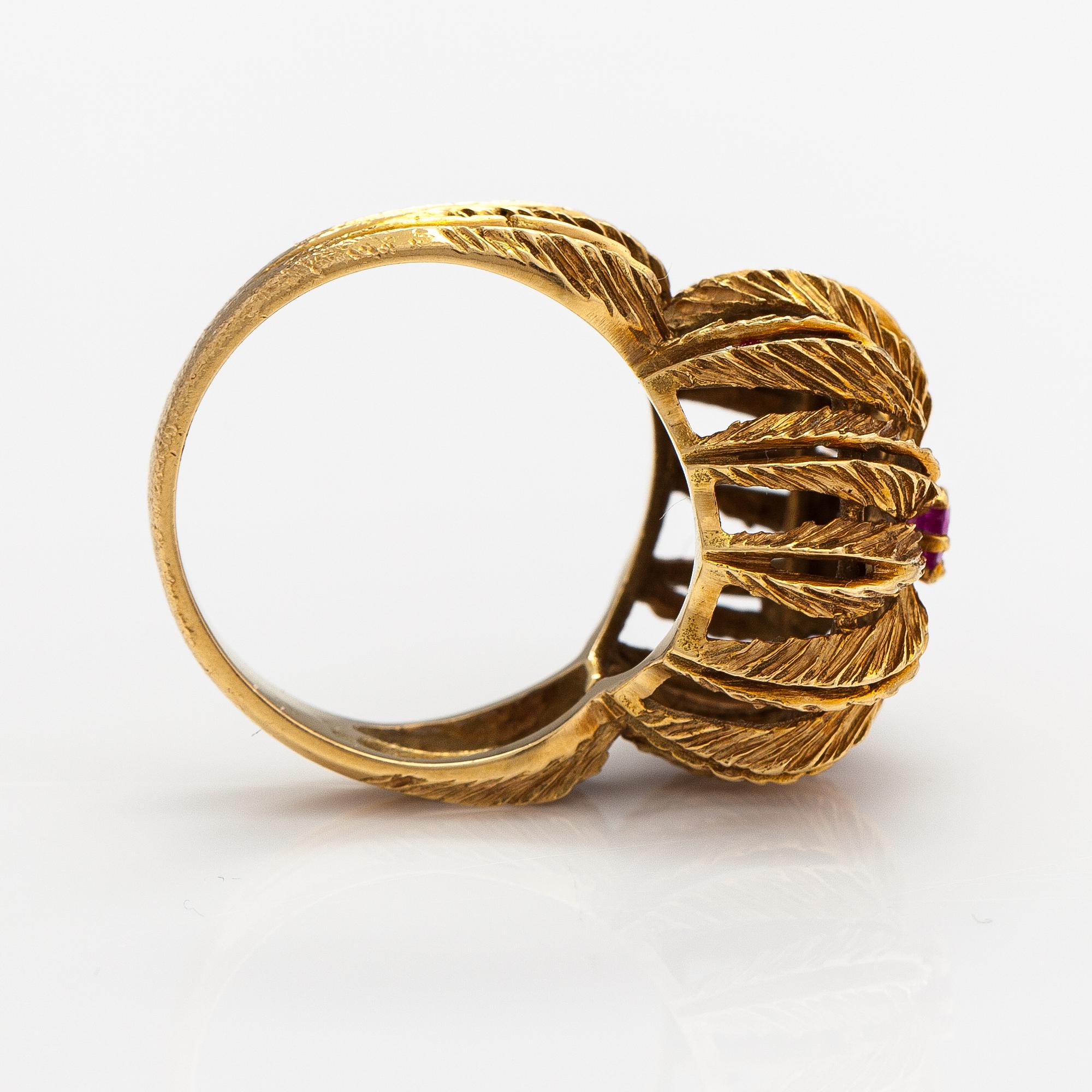 An 18K gold ring with a ruby.