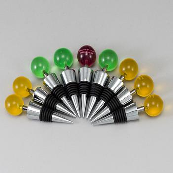 A set of 9 champagne stoppers, 1970s.