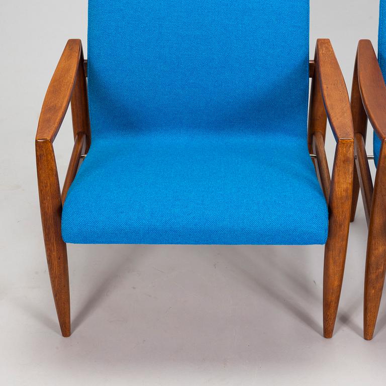 A pair of 1950's armchairs.