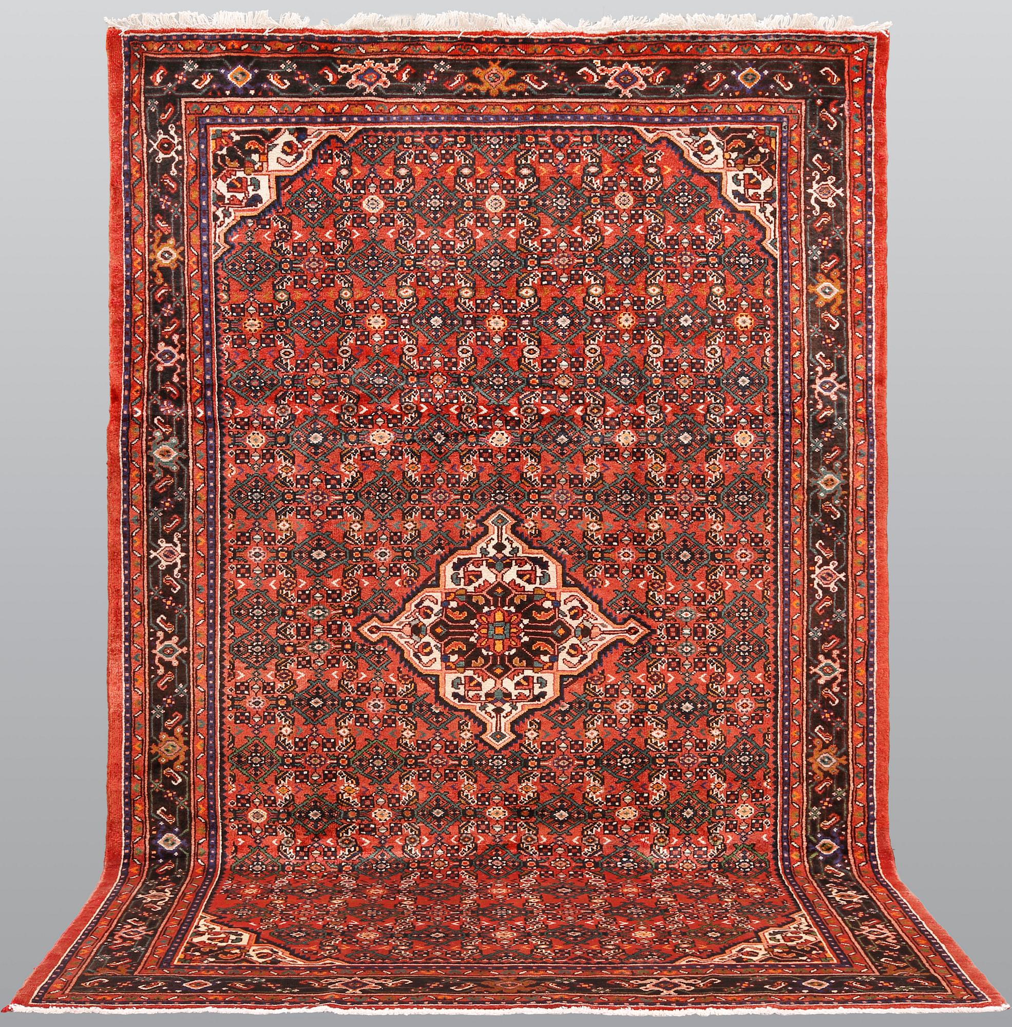 A Hosseinabad carpet,, ca 310 x 210 cm.