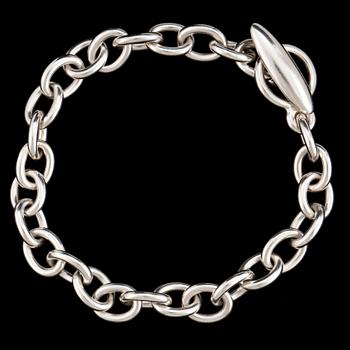 A silver bracelet and three charms by Georg Jensen, after 1945.