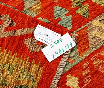 A Kilim carpet, c. 248 x 179 cm.