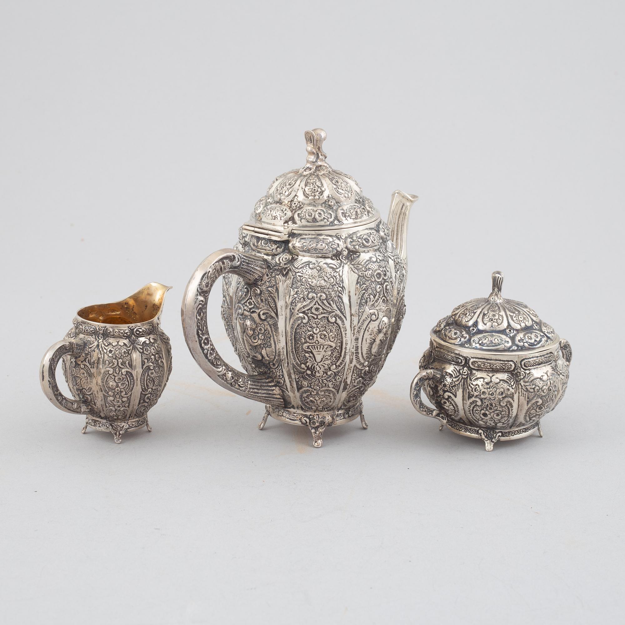 E.Jäntti, four silver cups, a three-piece silver coffee service and a silver tray, Helsinki, Finland,1979-81.